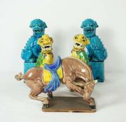 A pair of modern Chinese turquoise porcelain figures of lions, 30cm high; another polychrome pair,