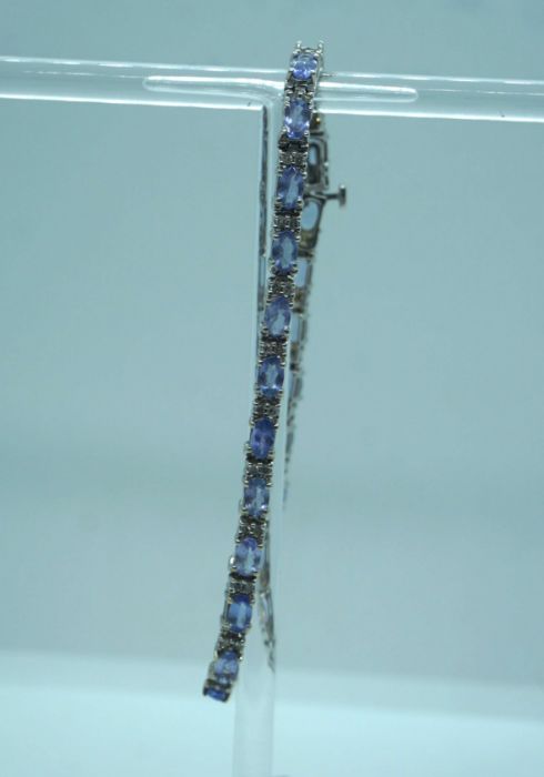 A 14 carat white gold, diamond and tanzanite cluster ring, total gross approx. 5 carats tanzanite, - Image 3 of 4