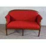 A George III mahogany small settee, currently upholstered in crimson, the back leg stamped 7821,