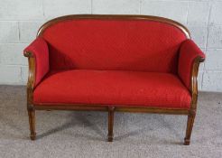 A George III mahogany small settee, currently upholstered in crimson, the back leg stamped 7821,