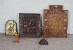 A Continental carved wood panel, of a man hunting on horseback; together with brass religious