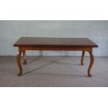 A French style coffee table, modern, with cabriole legs