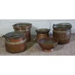 Three copper and iron pails, with overhandles, another smaller; together with a copper rose bowl (