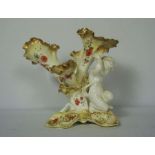 A quantity of decorative ceramics, including a fine Moore Bros table centrepiece with putti