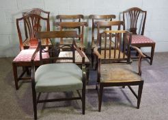 A set of four Regency simulated rosewood dining chairs, with carved ears, brass stringing and