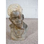 A stone bust of a young man, naturalistically carved with head slightly turned, signed ‘Shady’, 20th