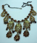A small quantity of costume jewellery, including a necklace with matching earrings and a large