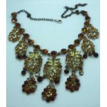 A small quantity of costume jewellery, including a necklace with matching earrings and a large