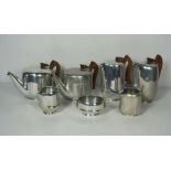 A Vintage 1950’s seven piece associated Piquot ware tea set, comprising two tea pots, two hot