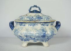 A group of ceramics, including a blue and white covered soup tureen, assorted covered pails, two