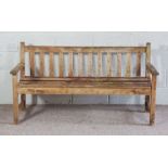 A modern garden bench, with slatted back, weatheredCondition reportApproximately 165cm x 57cm x 43cm