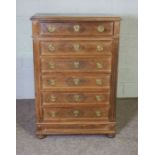 A Louis XVI style walnut chest of drawers, with a moulded top over six drawers, 120cm high, 80cm