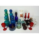 A mixed group of coloured glass, including a pair of ruby glass faceted goblets, assorted blue glass