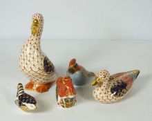 Three Royal Crown Derby figures, including a Squirrel, Wren and Lark, together with two similarly