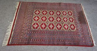 Three assorted rugs, including a small Tekke Turkoman, all 20th century (3)