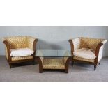 A pair of modern caned lattice bergere armchairs and a matching glass topped table (3)