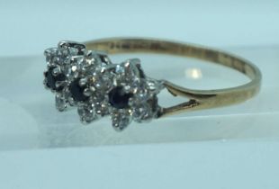 A 9 carat gold set cluster ring, with CZ type ‘diamond and sapphire’ setting, ring size U