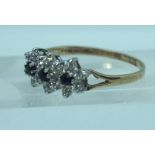 A 9 carat gold set cluster ring, with CZ type ‘diamond and sapphire’ setting, ring size U