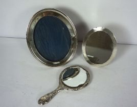 Two silver picture frames, including an oval frame with engine turned decoration, Birmingham 1894,