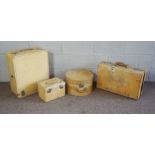 A vintage set of four calf suitcases, including a hat box and vanity case, all with chrome