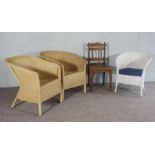 A pair of wicker Colonial style armchairs, together with another smaller painted example and an