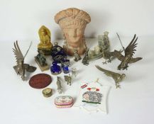 A group of assorted decorative items, including a terracotta classical bust, carved soapstone