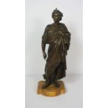A Victorian bronze figure of Caesar, unsigned, standing wearing a toga, set on a stone base, 49cm