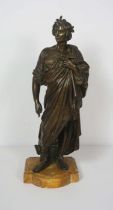 A Victorian bronze figure of Caesar, unsigned, standing wearing a toga, set on a stone base, 49cm