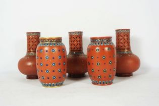 A pair of Mettlach stoneware vases, base stamped 1899, with Secessionist decoration, 29cm high;