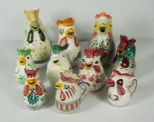 A large assortment of Italian Deruta Majolica pitcher jugs, all with assorted chicken head spouts,