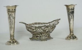 A Victorian silver sweetmeat basket, London 1892, of pierced oval form, with a scrolled and