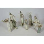 A group of assorted LLadro, including a seated boy and his companion, a child holding a cockerel,