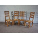 A set of four rush seated oak ladder back kitchen chairs, 20th century (4)
