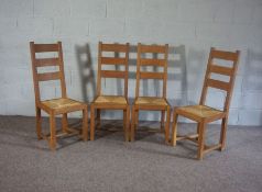 A set of four rush seated oak ladder back kitchen chairs, 20th century (4)