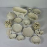A quantity of blanc de chine decorative ceramics, including flower heads, a model of a hip bath