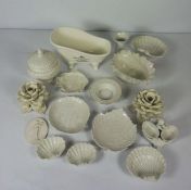 A quantity of blanc de chine decorative ceramics, including flower heads, a model of a hip bath