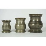 Nine assorted pewter tankards, including a graduated baluster group, impressed marks