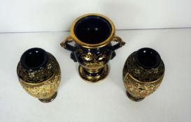 A pair of Japanese Satsuma decorative vases, Meiji period, decorated with stylised figures in a