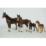 Two Beswick mares and their foals (one foal unsigned), tallest 14cm high (4)