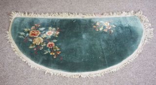 Five small modern rugs, various shapes and colours