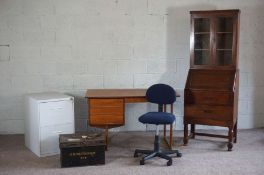 A group of office furniture, including an early 20th century bureau bookcase, a vintage desk, two