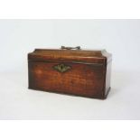 A George III mahogany tea caddy, late 18th century, the hinged lid opening to reveal two tin tea