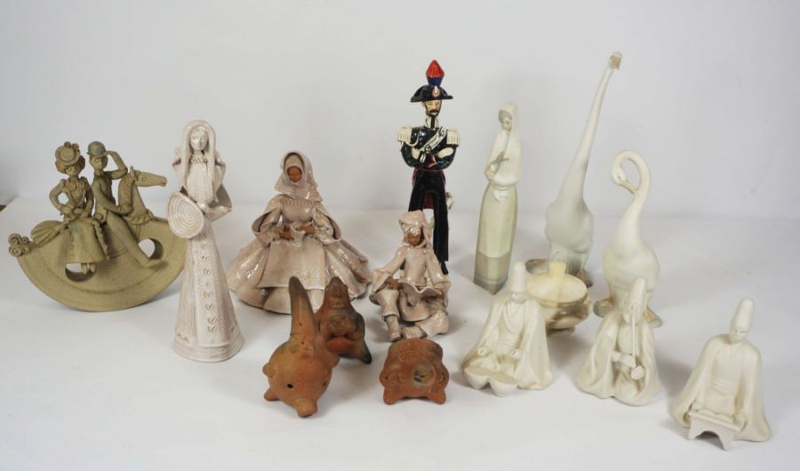 Lot of various figurines, including a rocking horse, grotesque figures, a runner duck etc (a lot)