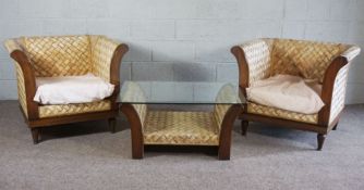 A pair of modern caned lattice bergere armchairs and a matching glass topped table (3)
