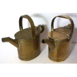 A pair of vintage brass watering cans, with hinged lids and oval ribbed sides, 28cm high (2)