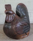 A large and carved hardwood cockerel, 52cm high, 61cm wide