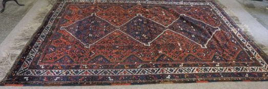 A large Caucasian tribal carpet, 20th century, with a central triple pole medallion decorated with