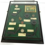 A Golf presentation case, with faux vintage balls and club heads and St Andrew’s Golf Club facsimile