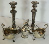 A pair of Victorian silver plated candlesticks, with embossed decoration, 29cm high; together with a