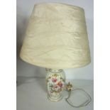 A Royal Crown Derby lamp base, decorated with flowers, together with two other table lamps, together
